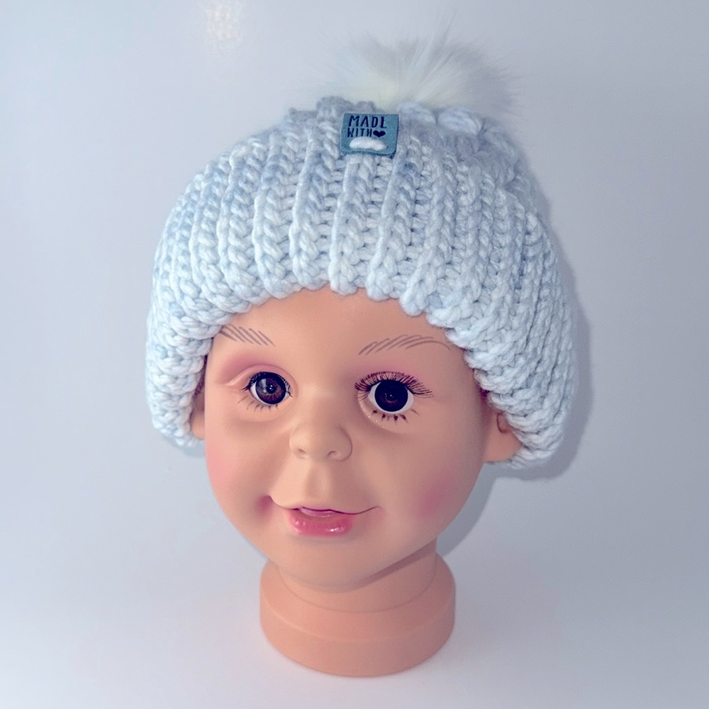 #13 Chunky,  light blue crocheted hat.